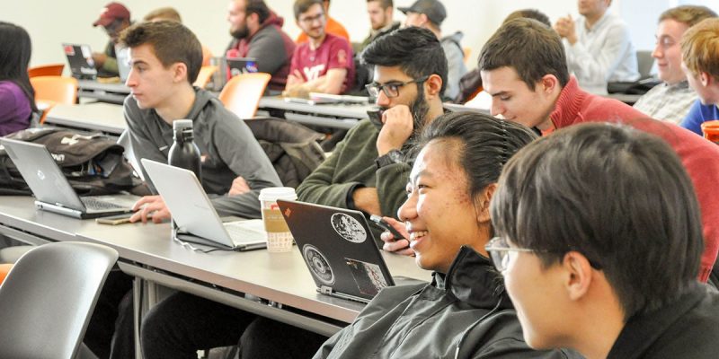 DSC_0189 Students laugh during a lecture.