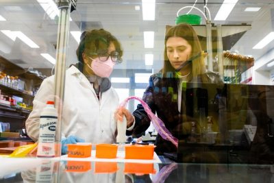 Two female students working in lab